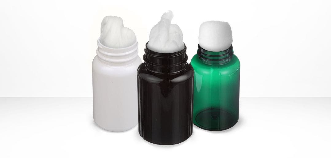 3 packer bottles showing pharmaceutical coil or ball at the top. Left to right: White Bottle, Dark Amber Bottle, Green Bottle