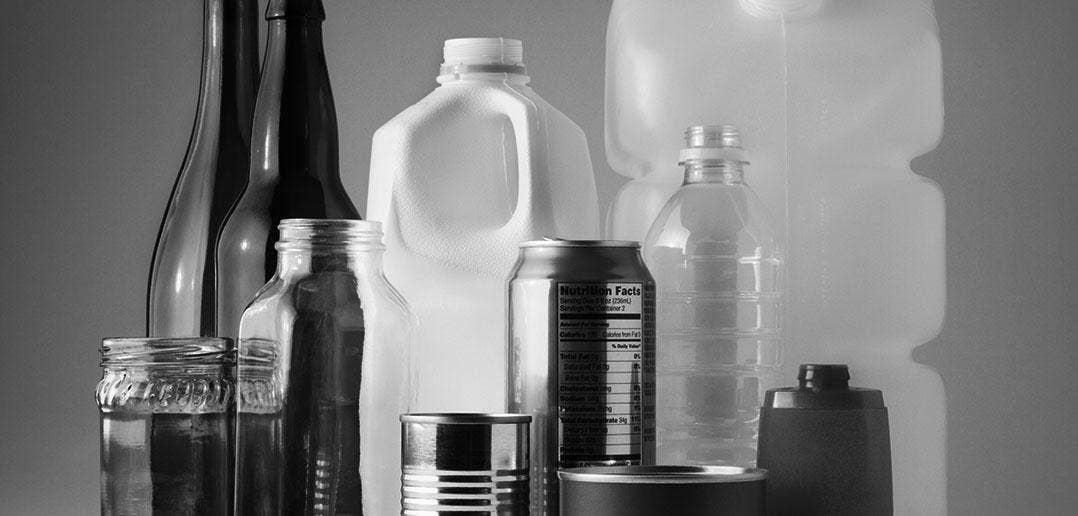 Black and white photo of various types of bottles.