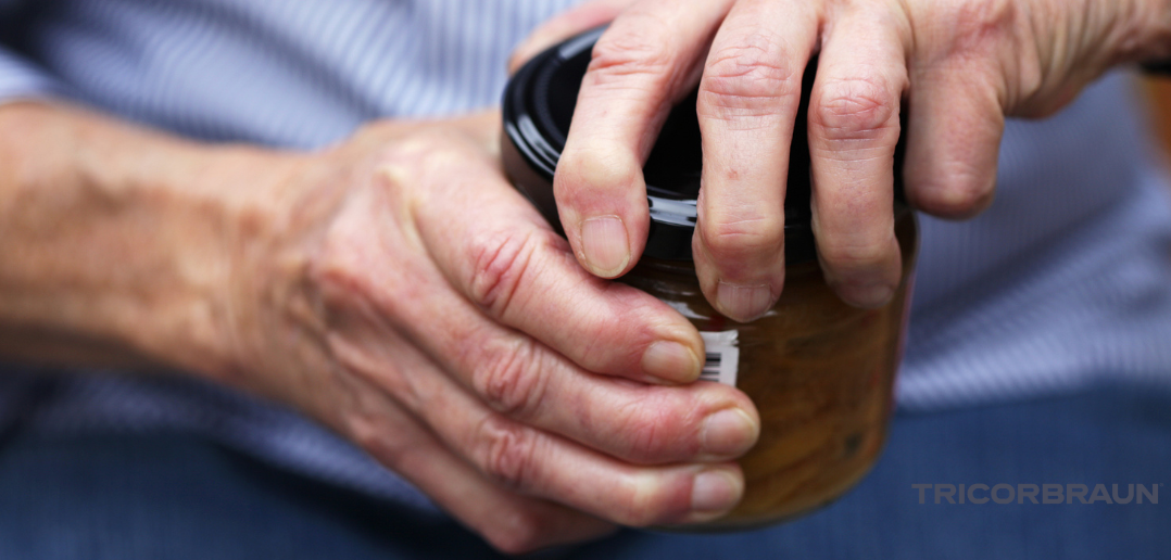 Someone's hands closing a jar