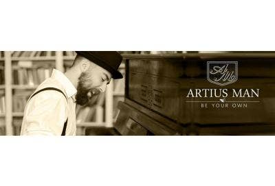 A man associated with Artius Man products playing a piano