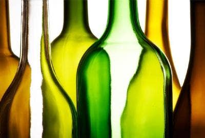 Image of different colored long neck bottles next to each other. 