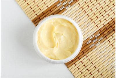 A picture of a container filled with body butter