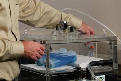 Person quality testing two bottles of cleaning products.