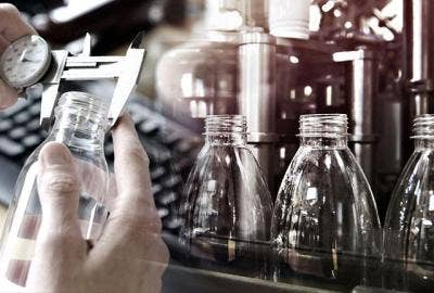 Someone measuring and testing multiple glass bottles