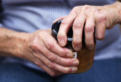 Someone's hands closing a jar