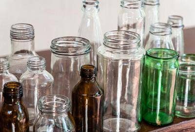 multiple colored glass bottles on a table