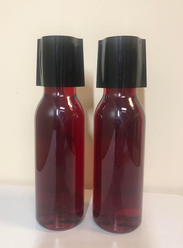 Two Bottles with Shrink Bands on Before Heating